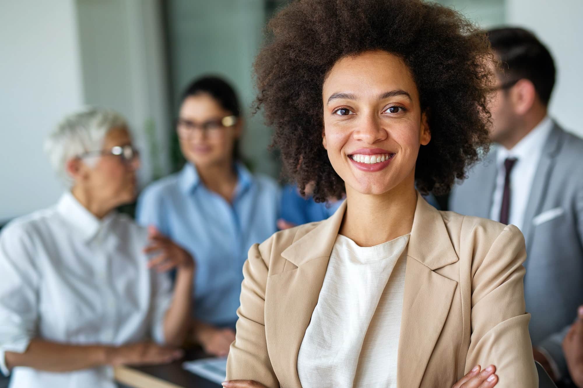 Portrait of a successful black business woman smiling in corporate office.