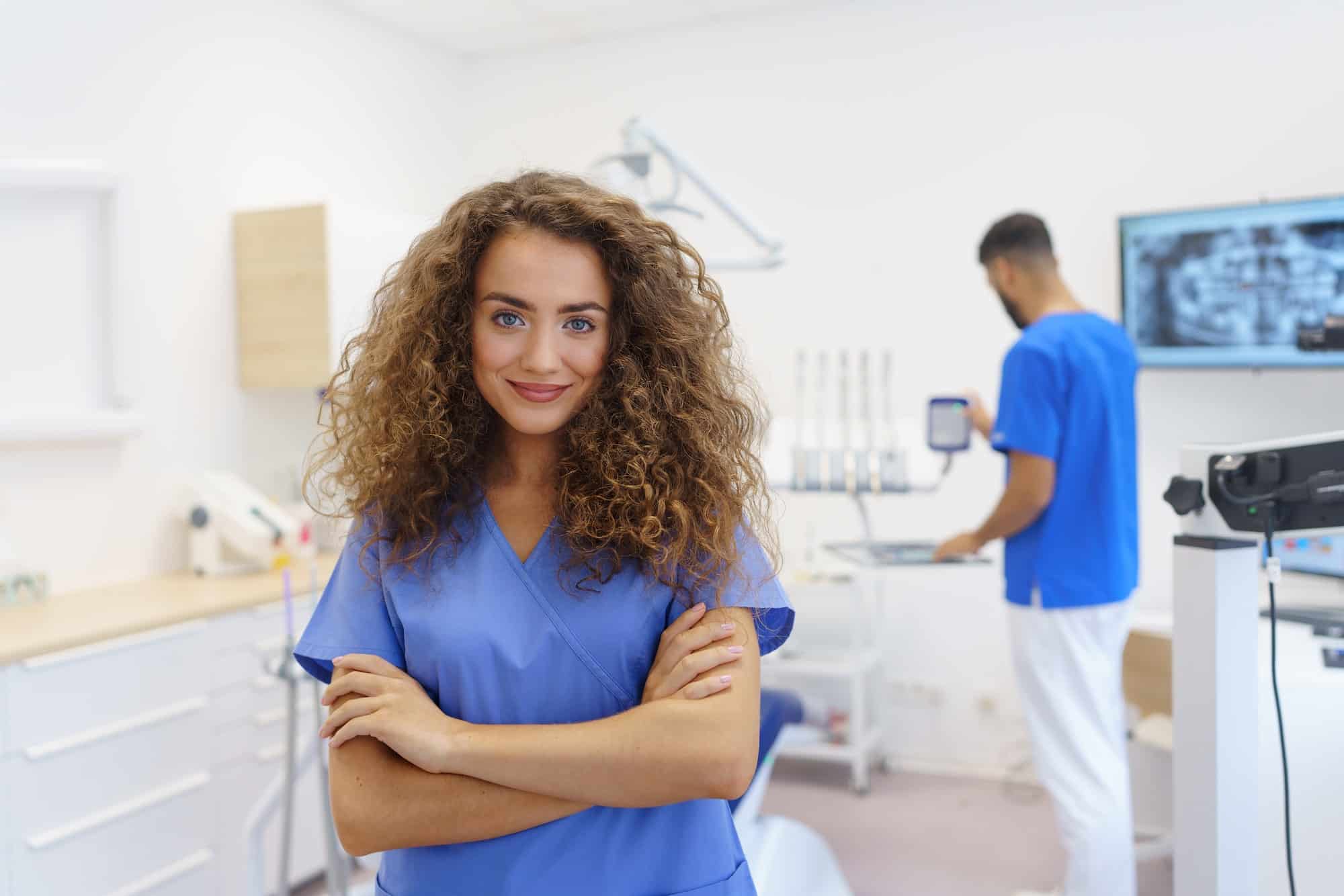 Portrait of young woman dentist at private dental clinic.